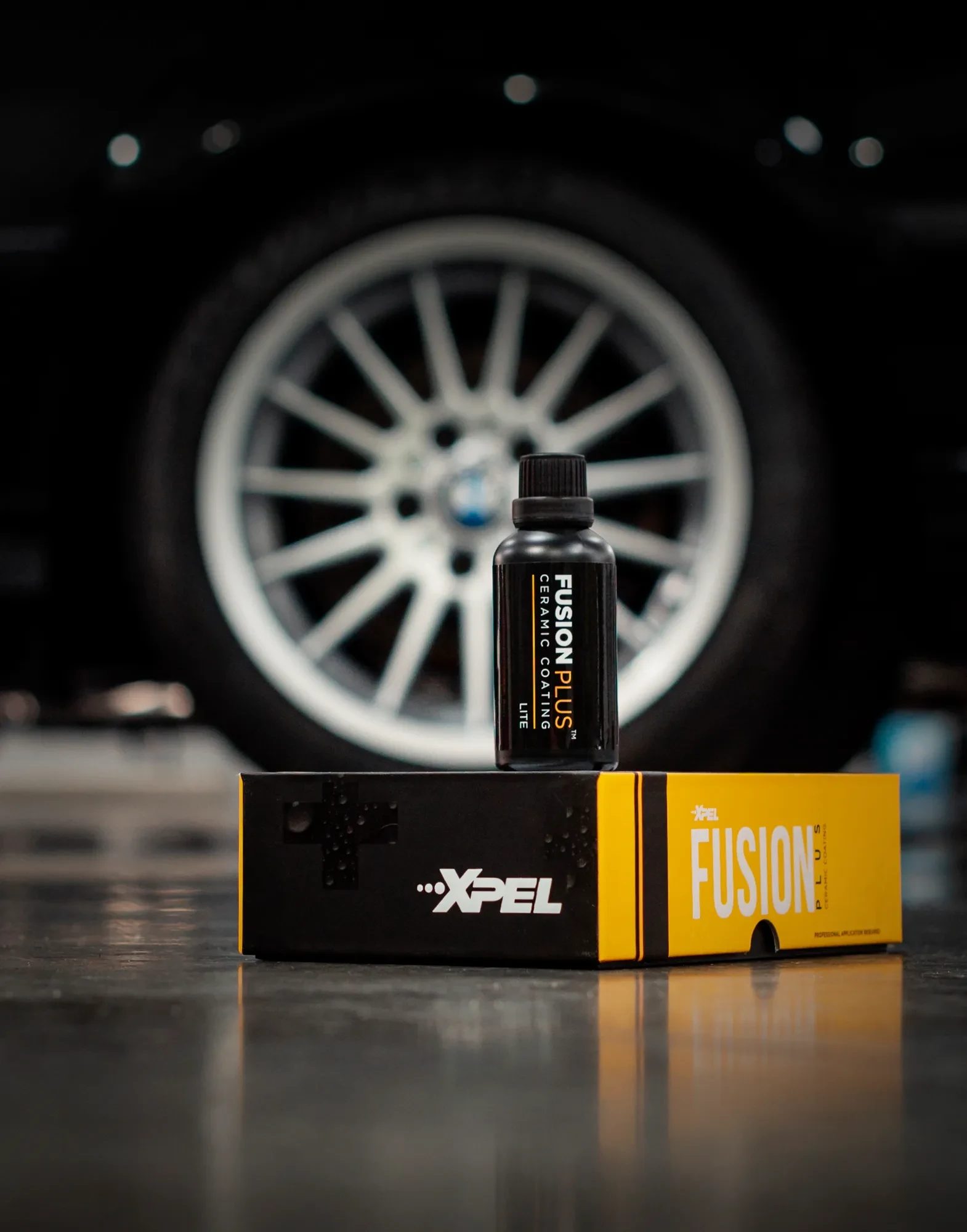 XPEL Fusion Plus Lite ceramic coating bottle on its box