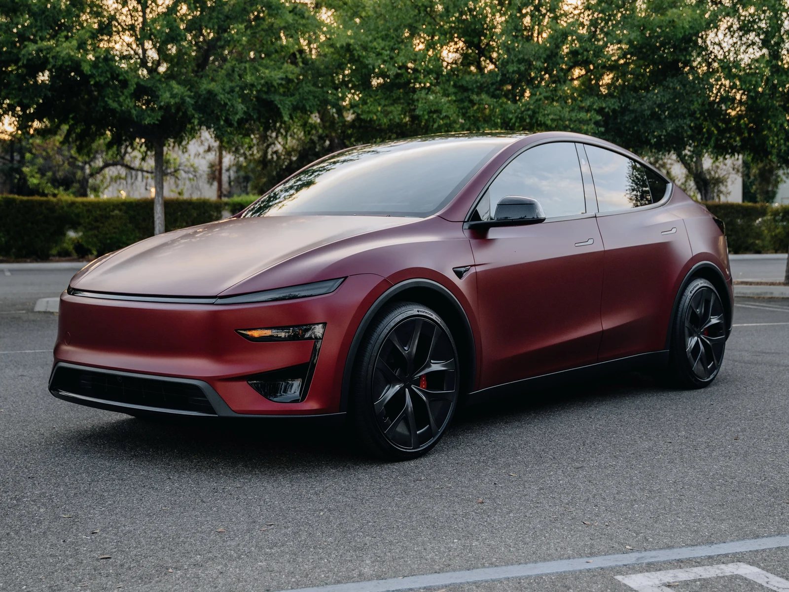 Red Tesla Model Y with full-body satin XPEL Stealth paint protection film