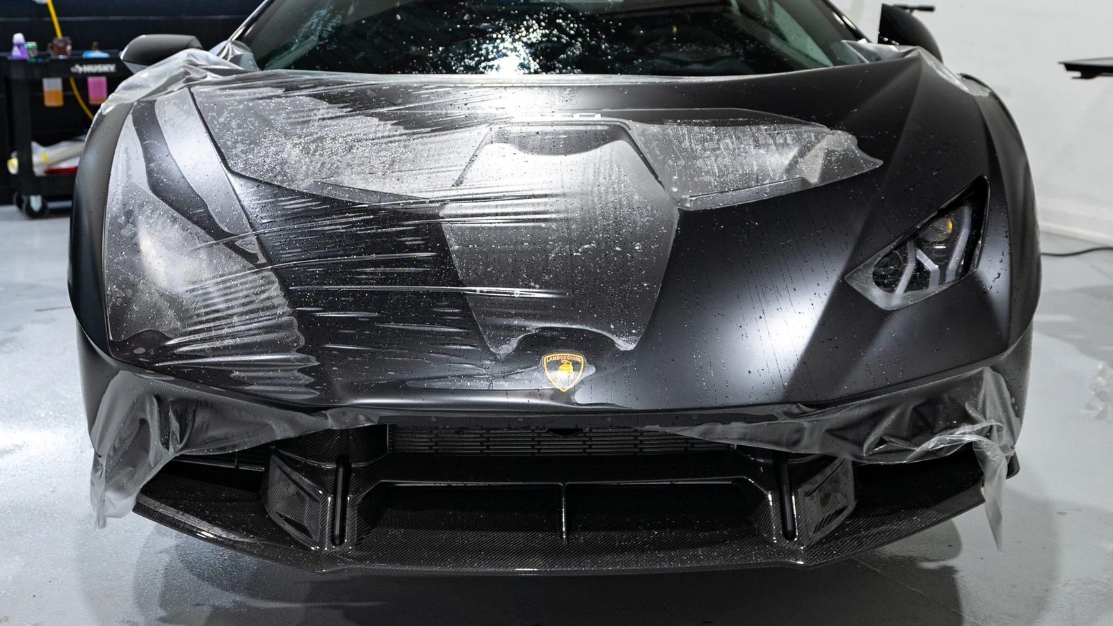 Black Lamborghini wrapped in XPEL paint protection film