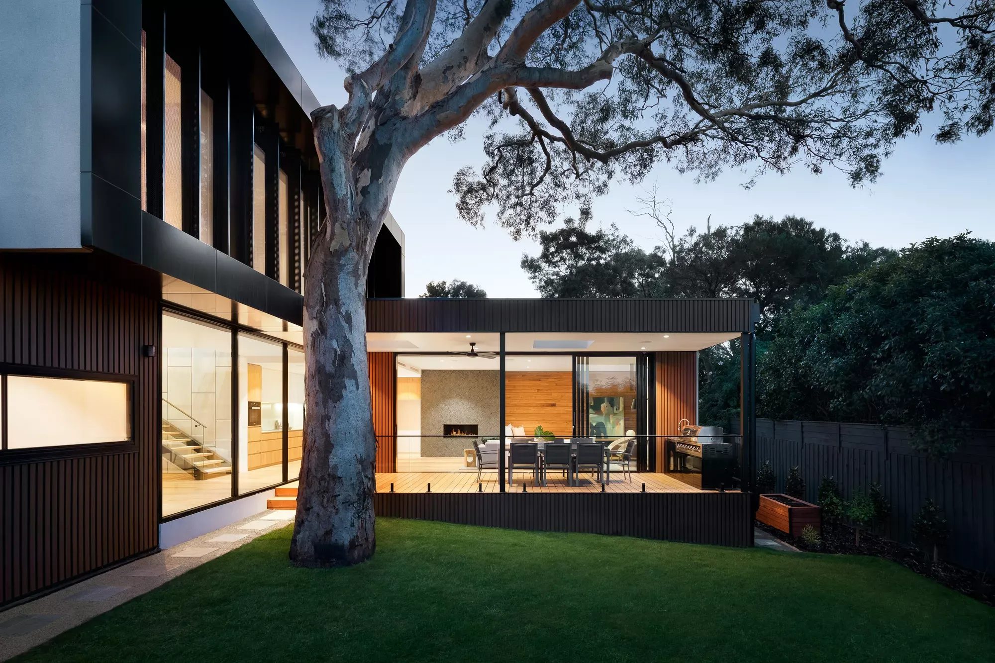 Modern home with large windows at dusk